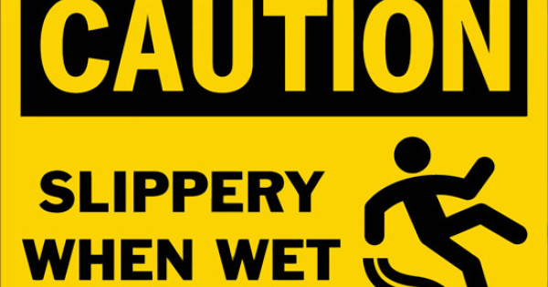 Caution Slippery When Wet Safety Sign